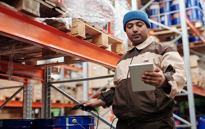 Man doing inventory in a warehouse