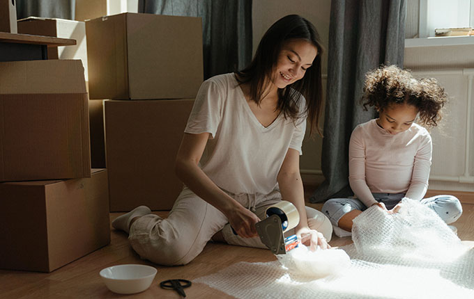 Woman packing boxes