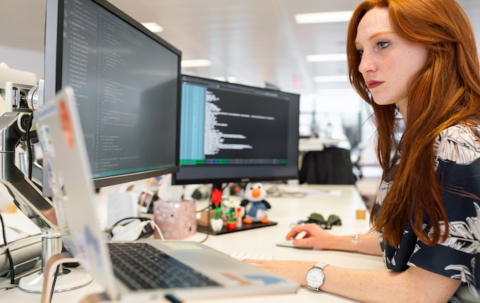 Woman working on computers