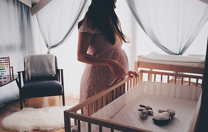 Mother preparing a nursery