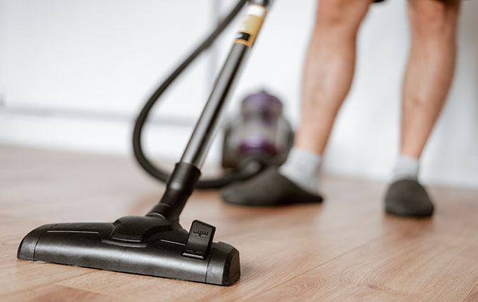 Vacuuming Hardwood in Slippers