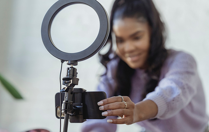 Woman recording from Phone Stand