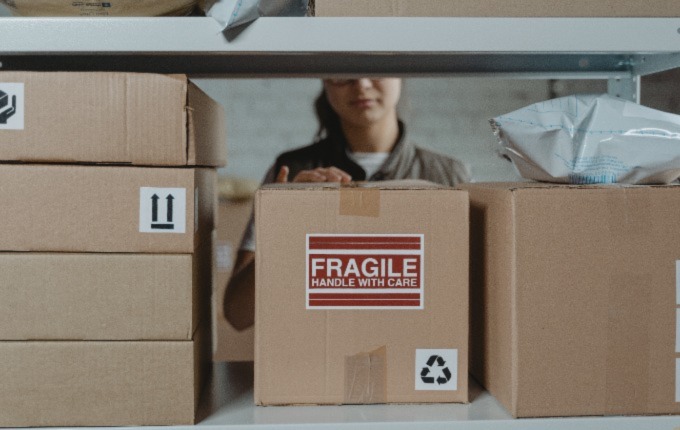 Cardboard boxes on a warehouse shelf